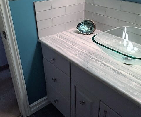 Tile backsplash behind bathroom vanity