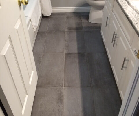 Grey floor tile in a bathroom