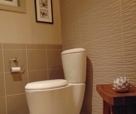 Bathroom with tiled floor and wall