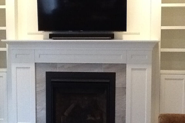 Close up of fireplace with tile surround
